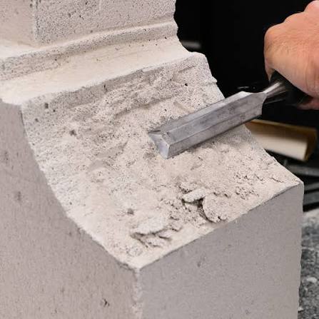 Artisan Indiana limestone carved fireplace surround, custom fabricated by Tulip Limestone · Precast